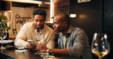 Wine, friends and men with phone in restaurant for social media, online message and conversation....