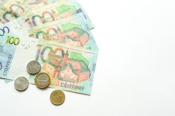 Belarus currency banknotes and coins on white background, representing finance, currency concepts.,...