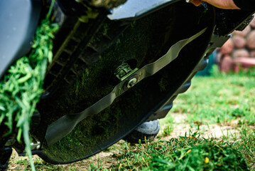 Close up of lawn mower blade.