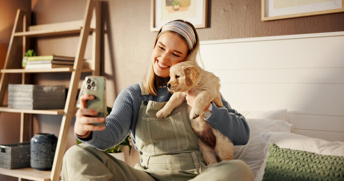 Selfie, bed and relax with woman and puppy for social media post, pet influencer and love. Dog content creator, photography and golden retriever with person in home for animal care and trust