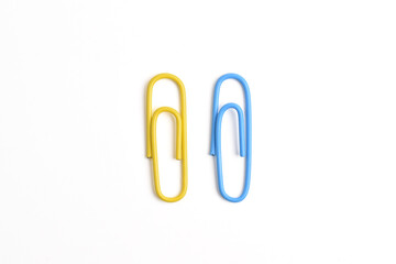 Two paper clips isolated on white background