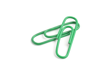 Naklejka premium Two green paper clips isolated on white background