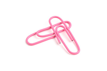 Two pink paper clips isolated on white background