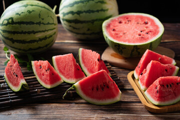 fresh ripe sliced watermelon fruit on wooden table.