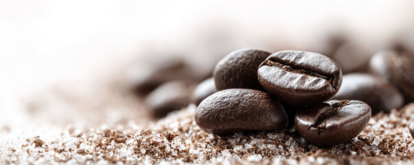 Freshly roasted coffee beans resting on sugar granules create a rich aroma in a cozy café setting