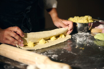 Chef Crafting Fresh Dough in a Cozy Kitchen Environment Depicting Culinary Art and Tradition