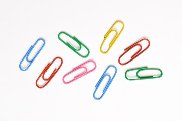 Colorful paper clips isolated on white background
