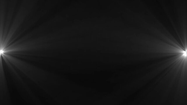 White light rays on black background.