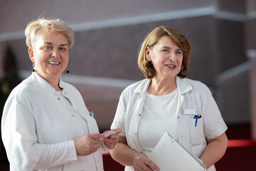 Group of female doctors reviewing medical document