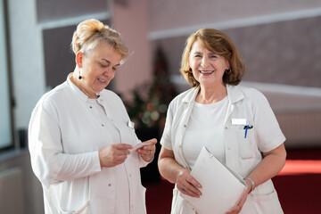 Group of female doctors reviewing medical document