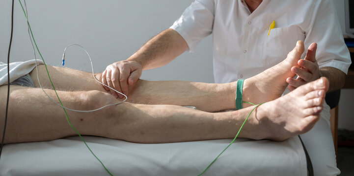 Doctors performing patient diagnostics with equipment