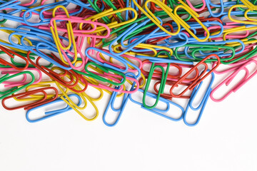 Colorful paper clips isolated on white background. Copy space. Copy space for your text and information