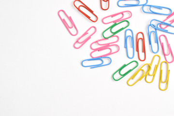 Colorful paper clips isolated on white background. Copy space. Copy space for your text and information