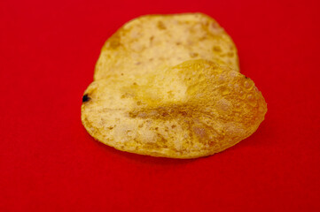 One single isolated fried potato chip