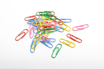 Pile of colorful paper clips isolated on white background