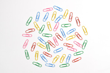 Colorful paper clips isolated on white background, flat lay, top view