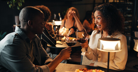 Happy couple, wine glass and toast on date at restaurant with partner, smile and relationship goals. African woman, man and alcohol beverage with celebration, excited and romantic night with drink