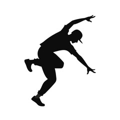 Dynamic silhouette of a solo street dancer in action
