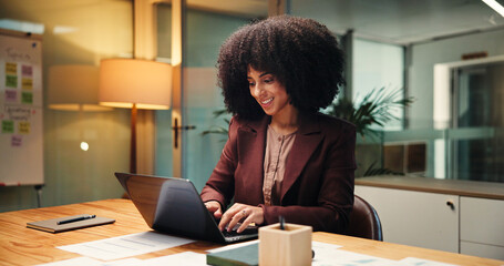 Business, woman and laptop in office at night for accounting, finance report and budget review....