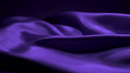 Close-up view of a rich, deep purple silk fabric with flowing folds. - Powered by Adobe