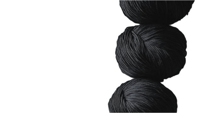 Three Spools of Black Yarn Isolated on a Dark Background