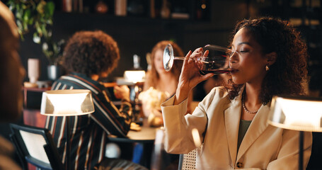 Woman, night and drinking with wine in restaurant for fine dining, dinner or anniversary in cafe....