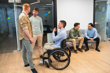 Business team discussing project in coworking space, demonstrating workplace inclusivity and...