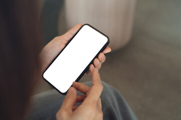 Close up, cell phone blank screen mockup. Woman hand holding, using smartphone with blank white screen mockup for social media marketing or web template design