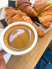 French croissant and cup of espresso coffee