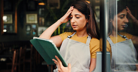 Barista, stress or woman at cafe with tablet for inflation, bankruptcy or financial crisis. Sad,...