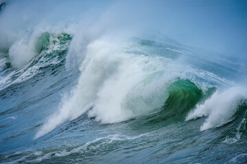 Powerful ocean waves crash along the Hermanus shoreline after a dramatic winter storm, capturing the raw energy and beauty of nature on the Whale Coast, Overberg, Western Cape, South Africa.