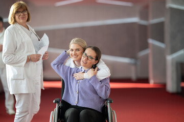 Doctor checking patients progress in wheelchair