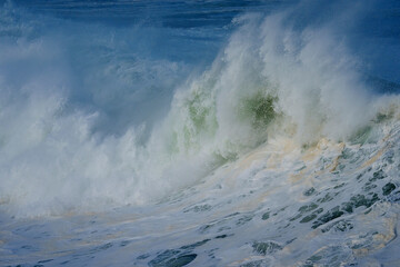 Powerful ocean waves crash along the Hermanus shoreline after a dramatic winter storm, capturing the raw energy and beauty of nature on the Whale Coast, Overberg, Western Cape, South Africa.