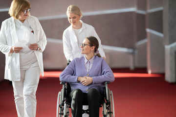 Doctor checking patients progress in wheelchair