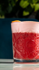 Ornate ruby cocktail radiates elegance, perfect for midsummer celebrations, infusing Nordic...