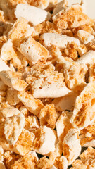 Craggy meringue shards cascade in a crispy avalanche, perfect for Gourmet Week celebrations and Honeycomb Crunch Day delights