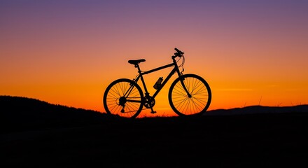 Cycling at Sunset Silhouette of Bike Against Orange Sky