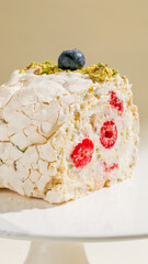 Cracked meringue embraces raspberries and pistachio confetti, ideal for Pi Day indulgence or...
