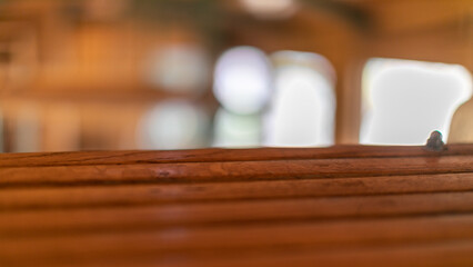 Wooden table surface basking in warm sunlight, evoking Hygge coziness and the quietude of Slow Living celebrations  Šarganska (sharganska) osmica