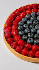 Raspberry and blueberry tart swirls like a colorful seasonal equinox, Pi Day delight, culinary fractal of edible art