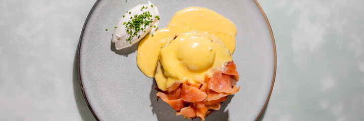 Luxurious smoked salmon eggs Benedict, sunlight glistening, a whisper of brunch sophistication, perfect for World Food Day celebrations