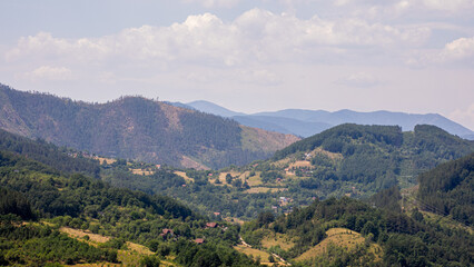 Serene valley panorama whispers ancient legends, picturesque Balkan meadows, ideal for Trifon...