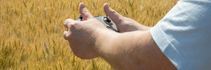 Hands conducting a drone symphony over golden wheatfields, Celtic Lughnasadh harvest rituals,...