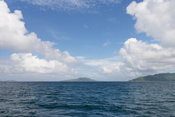 Side view from boat in Indian ocean sailing between Seychelles islands in daytime