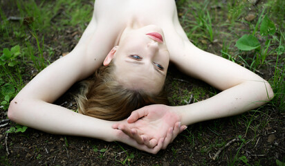 Beautiful blonde woman enjoy the forest.