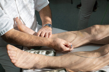 Doctors performing patient diagnostics with equipment