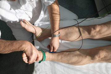 Doctors performing patient diagnostics with equipment
