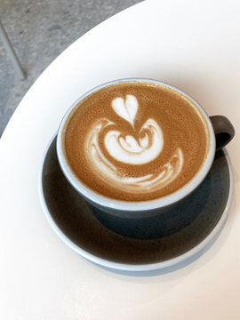 Flat White Coffee. Top View of Flat White Coffee with Beautiful Heart Latte Art. Barista Skill at Ltte Art.