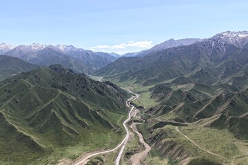 Fototapeta premium The aerial view of Qilian grassland and Qilian Mountains