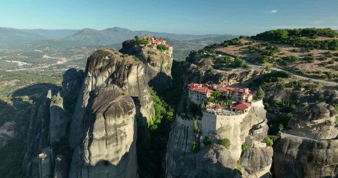 4K backward tracking motion of the Meteora Monasteries that was built on giant natural pillars in the second half of the 14th century,  UNESCO World Heritage site, Thessaly, Greece, Europe